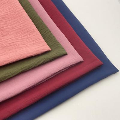 China AIYE NAIFEILE TEX Soft Plain Stretch Crepe CEY Raw Material 100% Polyester Spandex Elastic Compound Fabric for sale