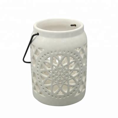 China Home Decoration White Ceramic Candle Lantern Hanging Candle Holder With Stainless Steel Handle for sale