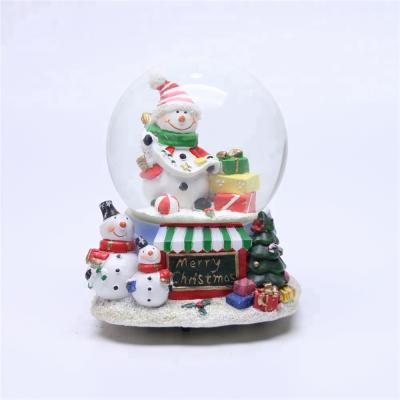 China Europe Christmas Gift Resin Glass Snow Globe Crystal Ball Music Box for sale