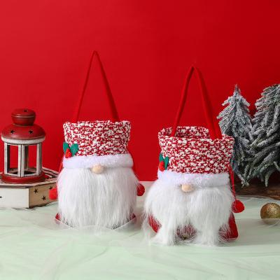 China Morden 2023 New Year Santa Claus Candy Bag Faceless Gift Bag Draw String Navidad Decor Party Gifts For Kids Modern Ornaments Supplies for sale