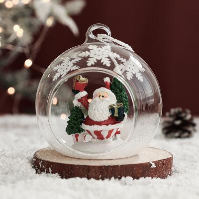 China Hot-selling New Year 2023 popular christmas gift small transparent hollow glass ball scene christmas elk snowman elk tree decoration old man santa for sale