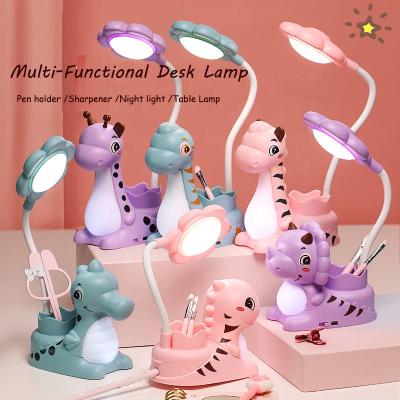 China Cartoon Amazing Cute Small Led Reading Learning Night Light With Sharpener Cartoon Dinosaur Pen Holder Creative Desk Lamp For Kids for sale