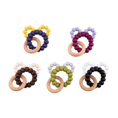 China Mixed Bead Ring Wooden Bead Wooden Teether Beach Color Silicone Baby Teether Safe Care Wooden Bracelet for sale