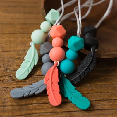 China Eco-Friendly Baby Teether Silicone Feather DIY Jewelry Teething Necklace Baby Care Accessories Mom Nursing Necklaces for sale