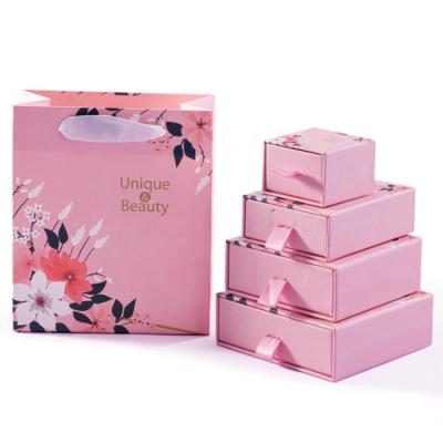 China Custom Recyclable Wholesale Pink Ring Box Cardboard Drawer Jewelry Box Sliding Jewelry Box With Ribbon Suction String for sale