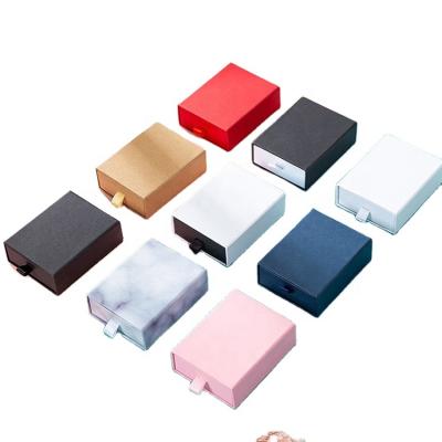 China Custom Colorful Recyclable Wholesale Luxury Jewelry Gift Box Cardboard Drawer Jewelry Box With Ribbon Suction String for sale