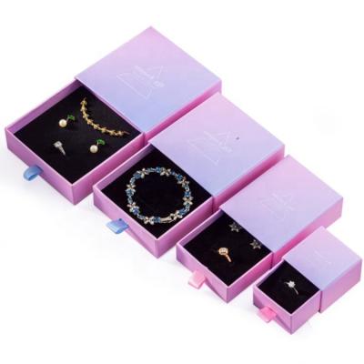 China Recyclable Wholesale Custom Jewelry Packaging Box Luxury Pink Blue Drawer Gradient Color Cardboard Jewelry Box With Ribbon Suction String for sale