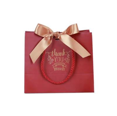 China Recycled Materials Customized Boutique Shopping Paper Bag With Red Paper Gift Bag Ribbon Handle Packaging Custom Euro Logo for sale