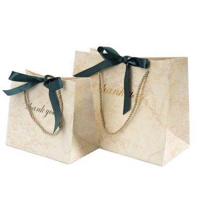 China Recycled Materials Customized Marble Shopping Paper Bag With Logo Luxury Paper Gift Bag With Bow for sale