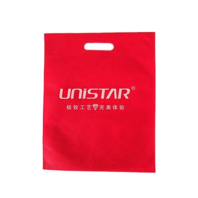 China Custom brand handled printing nonwoven ultrasonic die cut shopping logo pp spunbond bag handle nonwoven packaging bag for sale