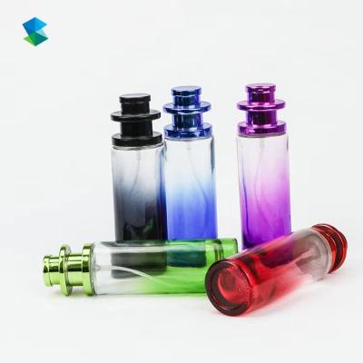 China Manufacturer 35ml Glass Recyclable Round Colored Perfume Bottle With Spray And Spiral Cap for sale