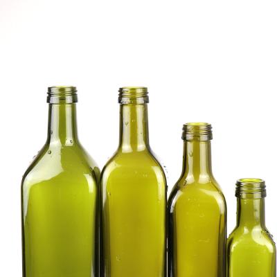 China Eco-friendly Recyclable Wine Bottles Wholesale Round 100ml 250ml 500ml 750ml Olive Oil Bottle Transparent Dark Green Empty Glass Beer Bottle for sale