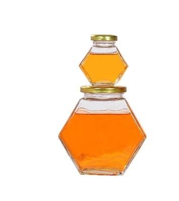 China Eco-friendly Recyclable High Quality Jam Storage Bottles Hexagon Shape 100ml 500ml 750ml Glass Honey Jar With Mental Black Lids for sale