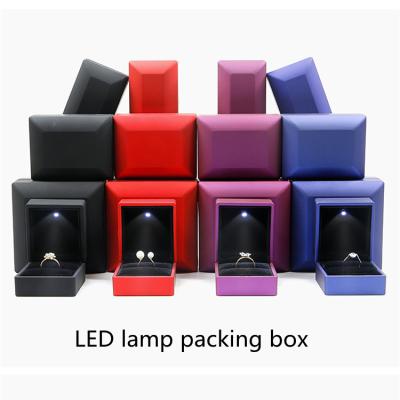 China Wholesale custom LED jewelry set box custom made jewelry velvet compound material logo lamp red wedding ring box for sale