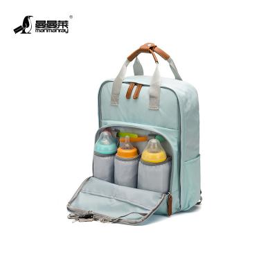 China Backpack Mommy Bag in Diaper Backpack Baby Diaper Packing Bags Multifunctional Traveling Backpack for sale