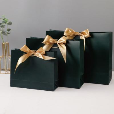 China Luxury Wholesale Custom Logo Printed Paper Shopping Gift Bags for sale