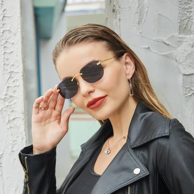 China Fashion sunglasses women 2022 rimless women sunglasses metal temple men's sunglasses new fashion simple for sale