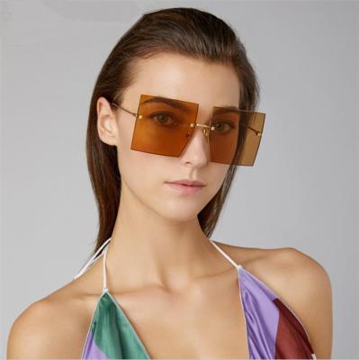 China Fashion Rimless Square Sunglasses Trend 2022 Female Flying Frame Eyeglasses Street Sun Glasses Ladies Sunglasses for sale