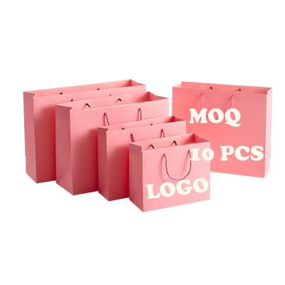 China Recycled Materials Custom Pink Shopping Bags Gift Package Bags Kraft Paper Bag for sale