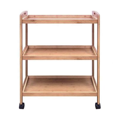 China Minimalist Three-Layer Log Bathroom Shelf Storing Serving Trolley Kitchen Shelf Kitchen Trolley With Wheels for sale