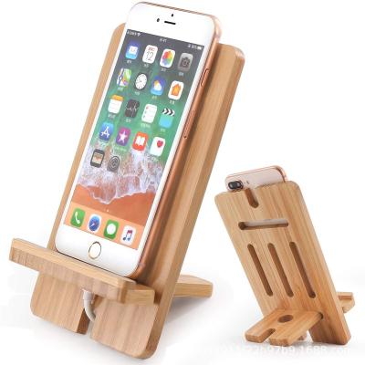 China Adjustable Wholesale Wooden Mobile Phone Holder Horizontal And Vertical Wood Crafts Mobile Phone Bracket for sale