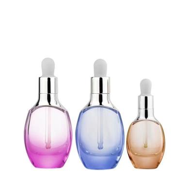 China Personal Care 15ml 30ml Golden Empty Clear Aluminum Cap Cosmetic Glass Bottle With Dropper For Face Oil for sale