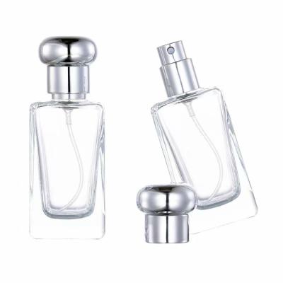 China Custom Men's Cosmetic Perfume Bottle Refillable Empty Clear Glass Samples Packaging 25ml Spray Bottle With Pump for sale