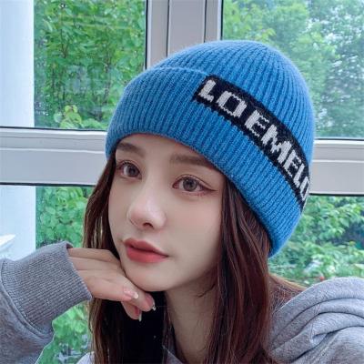 China COMMON knitted hat for cold windproof warm ear protector all-match autumn women winter letter Korean hat woolen hat for sale