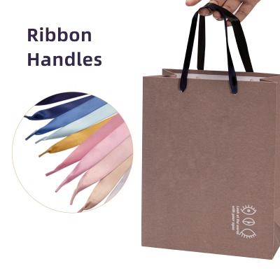 China Factory Wholesale High Grade Customized Logo Brand Name Gift Shopping Kraft Paper Bag Ribbon Handle Packing Rope With Burr Plastic Tips for sale