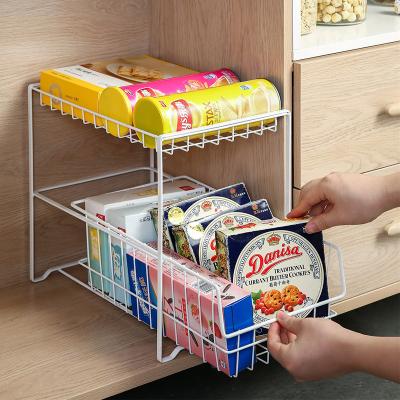 China Stored 2 Layers Of Iron Drawer Spice Bottle Jar Storage Rack Can Sink Push-pull Rack Multifunctional Finishing Shelf for sale