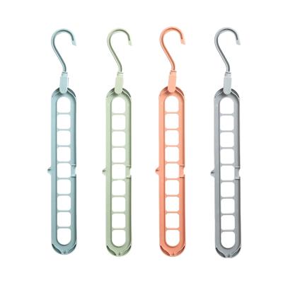 China Multi-function Multi-pattern Colorful Plastic 9-hole Wardrobe Wardrobe Magic Hanger Eco-friendly Space-saving Material for sale