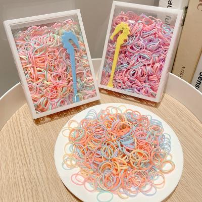 China Small One Pack 1000pcs Kids Rubber Band Elastic Hair Band Girls Hair Accessories Disposable Hair Accessories Fixed Box Ponytail Rubber Holder for sale