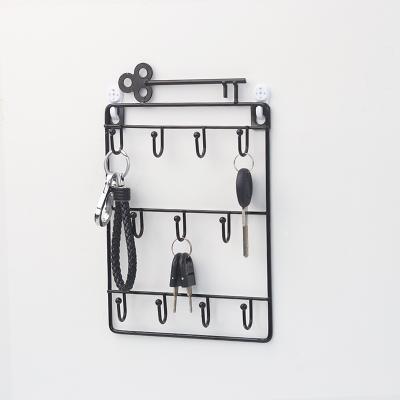 China Home Storage Metal Key Hook Black High Quality Float Decoration Rack Wall Shelf for sale