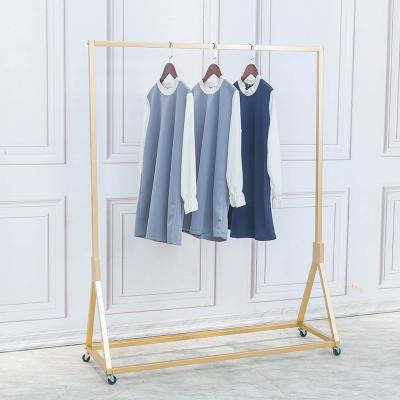 China Eco-friendly Gold Clothing Store Freestanding Display Stands Light Up Luxury Metal Coat Iron Hanging Metal Clothes Rack for sale