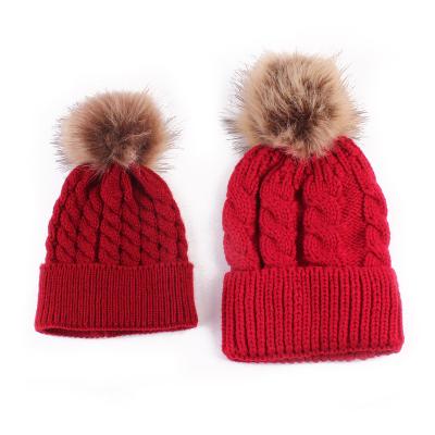 China 2021 COMMON Mom and Baby Knitted Faux Fur Pom Pom Thick Warm Winter Beanie Hat Parent-child Costume for sale