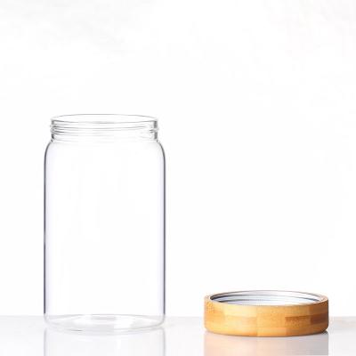 China Sustainable Leakproof Screw Borosilicate Glass Handmade Food Storage Jar With Acacia Wood Lid for sale