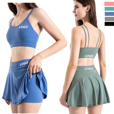 China Solid Color Woman Sports Bra Light Proof Tennis Breathable Sexy Skirts With Pockets Yoga 2 Piece Sets For Fitness for sale