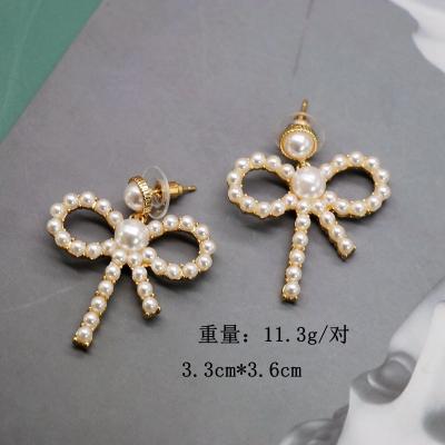 China Other Silver Elegant Small Pearl Bow Earrings Sweet Needle Earrings for sale