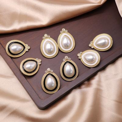 China Other Universal Pearl Ear Clip Ear Clip Oval Ear Drop Ear Clip Korean Black and White Alloy Universal Wholesale for sale