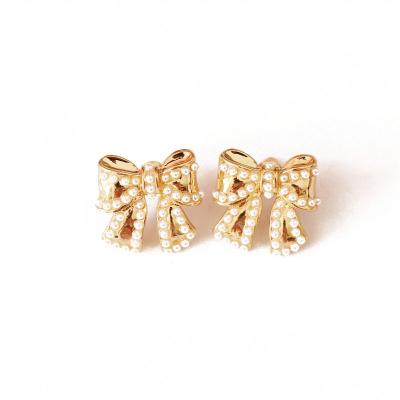 China Other small bow earrings pearl millet bow earrings white silver gold stiletto earrings for sale