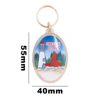 China Plastic Custom Acrylic Oval Key Chain With Snow Cartoon Key Ring Plastic Key Chain Souvenir Gift Give Away for sale