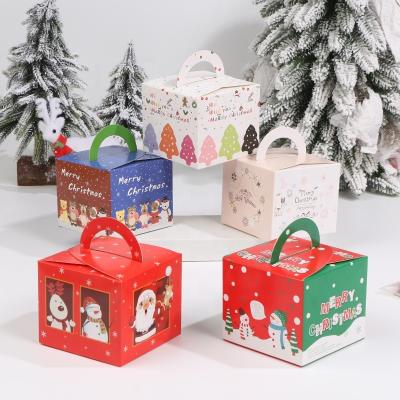 China Merry Christmas Cartoon Santa Snowman Paper Portable Handle Apple Recyclable Soft Gift Packaging Box for sale