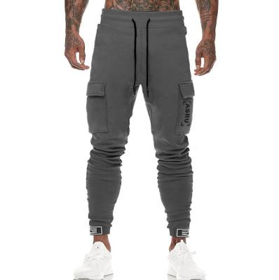 China Breathalbe Fitness Sports Pants Running Mens Training Pants Gym Sweatpants Cargo Pants With Many Pocket for sale