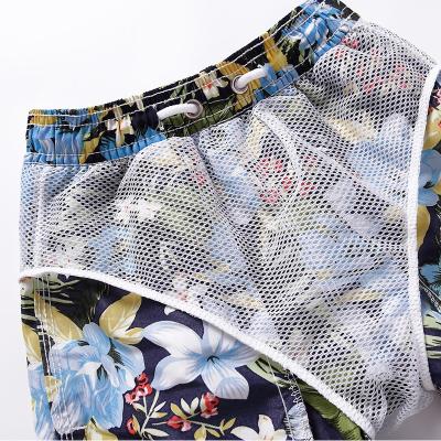 China Anti-wrinkle 2022 new beach shorts pocket drawstring beach pants children's beach shorts five-point printed loose casual swimming trunks for sale