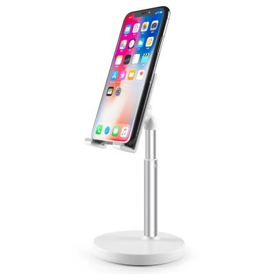 China Stand Up Cell Phone Or Tablet Metal Plastic Display Stand For Smartphones With Charging 360 Rotation Phone Table Holder for sale