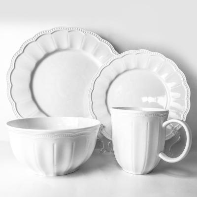 China Viable Wholesale 16pcs Engraving Fine Porcelain Dinner Set Bulk Cheap Dubai Embossed Ceramic Dinnerware for sale