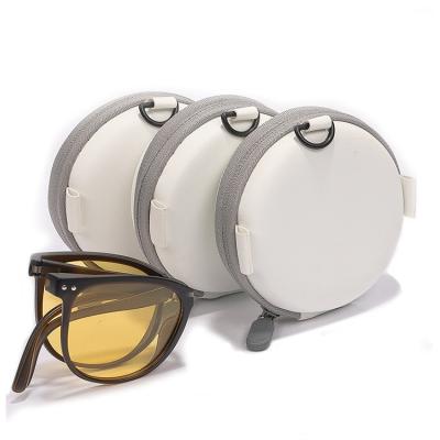 China Portable round leather sunglasses case folding show box and soft zipper glass case. for sale