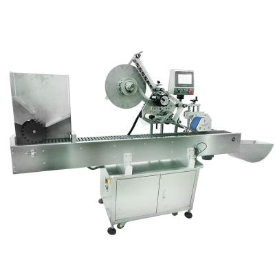 China YM215 Automatic Horizontal Food Labeling Machine For Small Tube Bottle Vial Label Applicator for sale