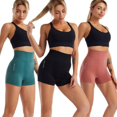 China Women's Yoga Pants Belly Peach Hip Fitness Pants Quick-Drying Tight Seamless Sexy Sports Breathable Three-Point Pants for sale