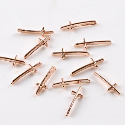 China If we have in TSZS HOT stock volume we rose gold cross nail art decoration metal studs nail accessories for nail salon for sale